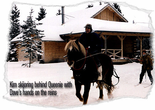 Kim skijoring behind Queenie with Dave's hands on the reins