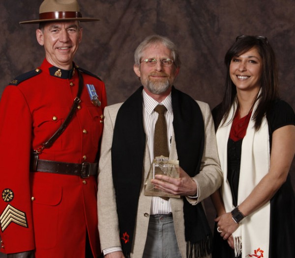 Cliff Speer holding Tourism Saskatchewan Award